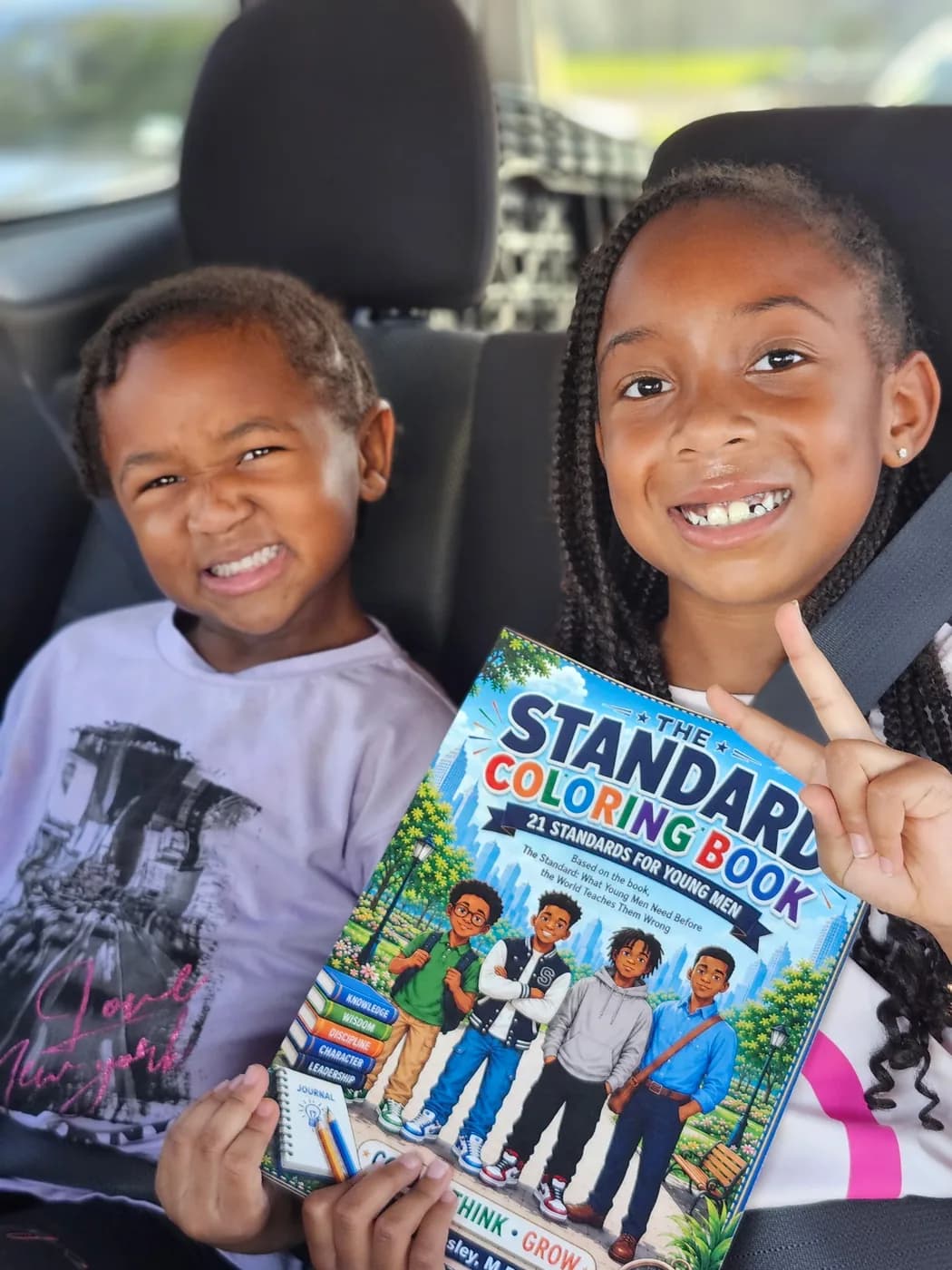 Reader holding The Standard by Carl Wesley