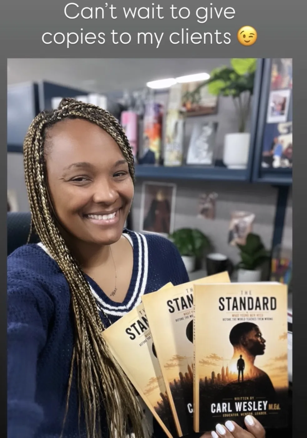 Reader holding The Standard by Carl Wesley