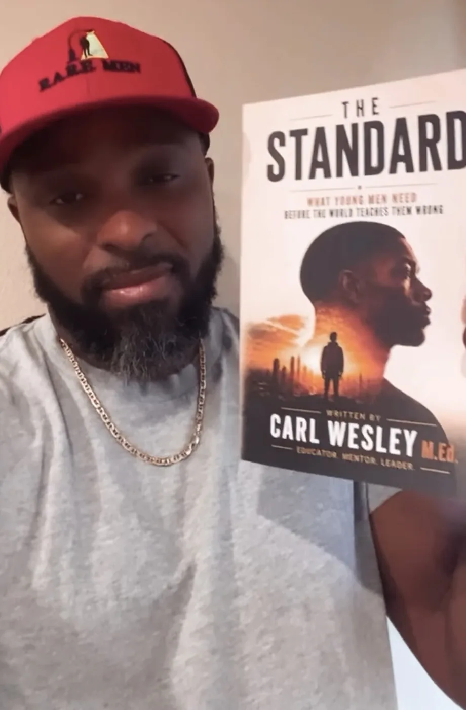 Reader holding The Standard by Carl Wesley
