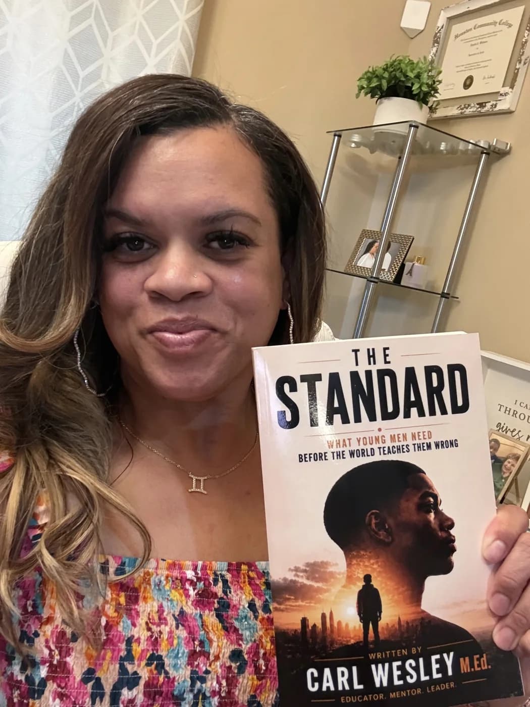 Reader holding The Standard by Carl Wesley