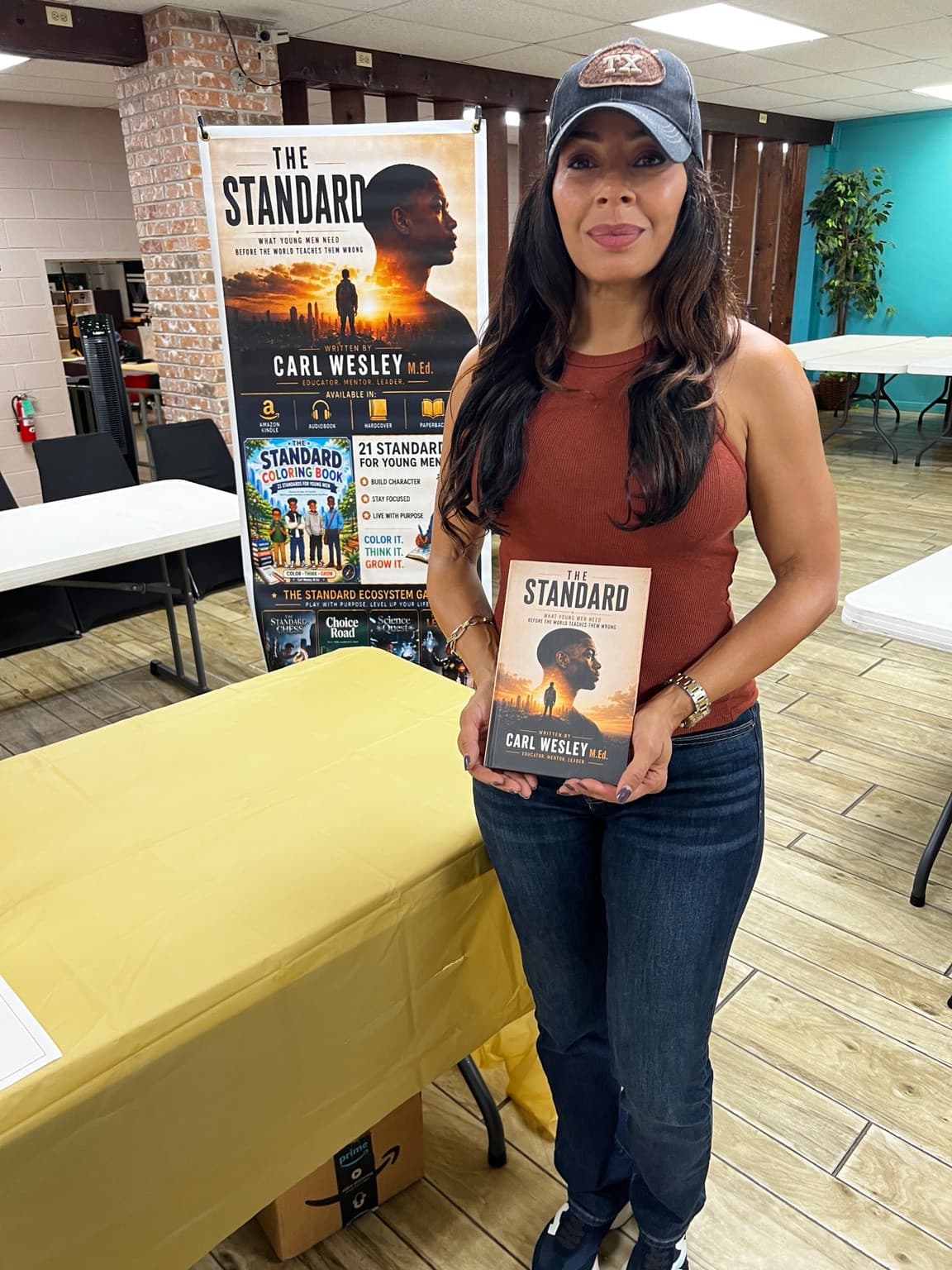 A reader holding The Standard